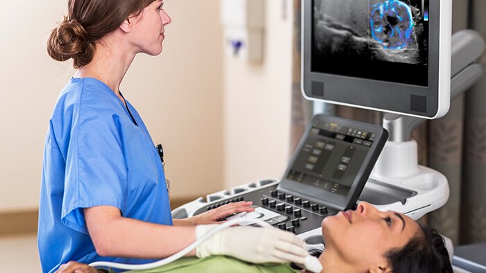 People looking at a large clinical image