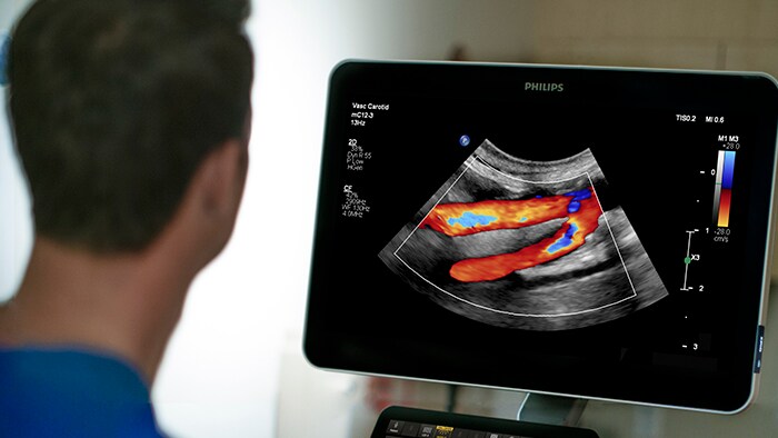 People looking at a large clinical image