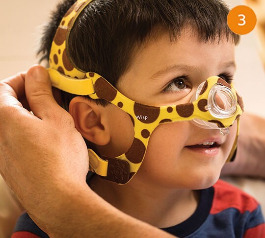 kid wearing sleep apnea mask