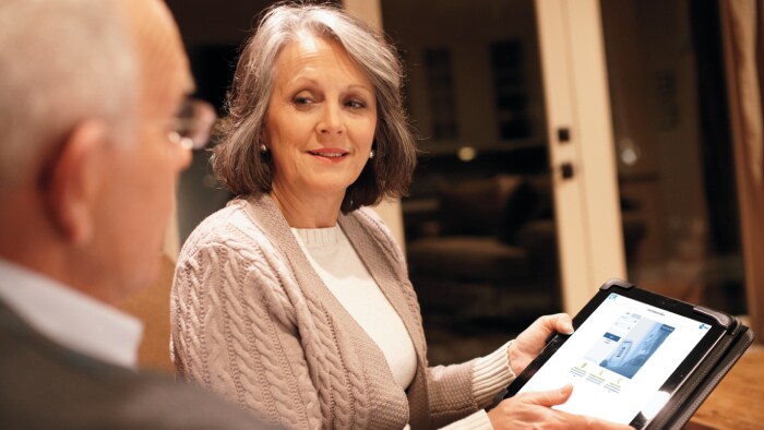 patients at home looking at the patient portal on a tablet